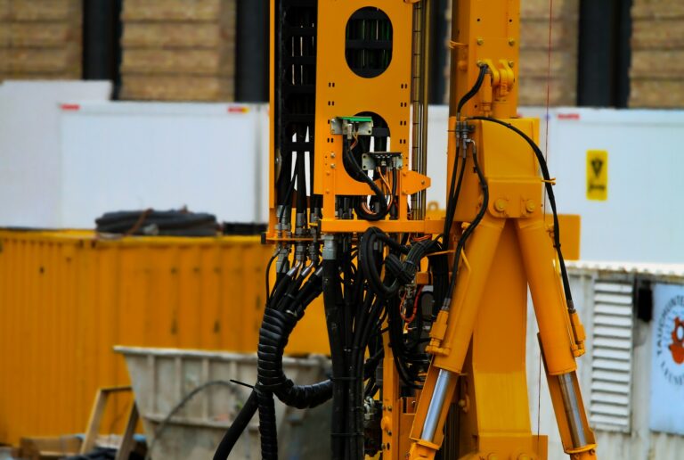 a yellow machine with a black handle